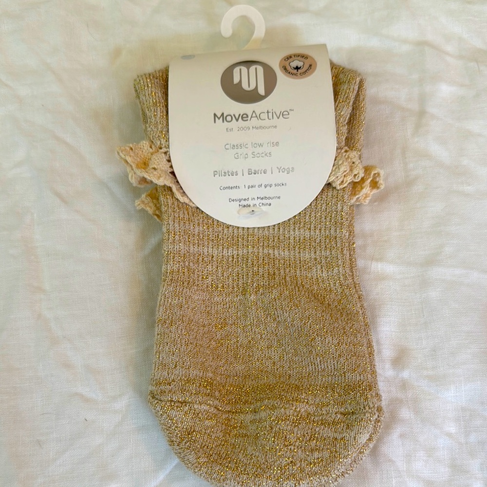 NWT MoveActive grip socks. Gold with ruffle. Size small.